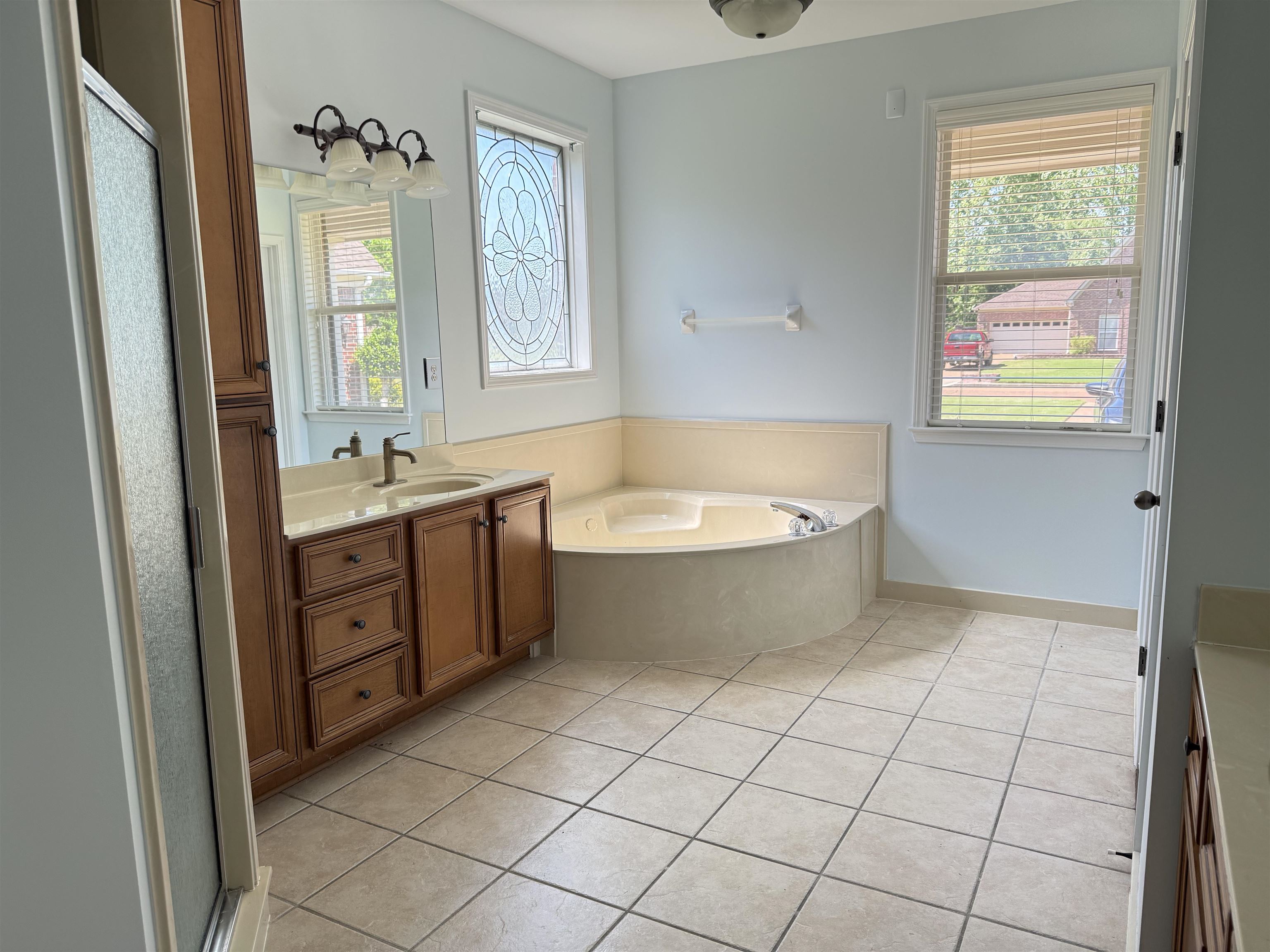 4560 Model Cove Bartlett, TN 38002 - Photo 11 of 18 a bathroom with a sink a mirror and a bathtub