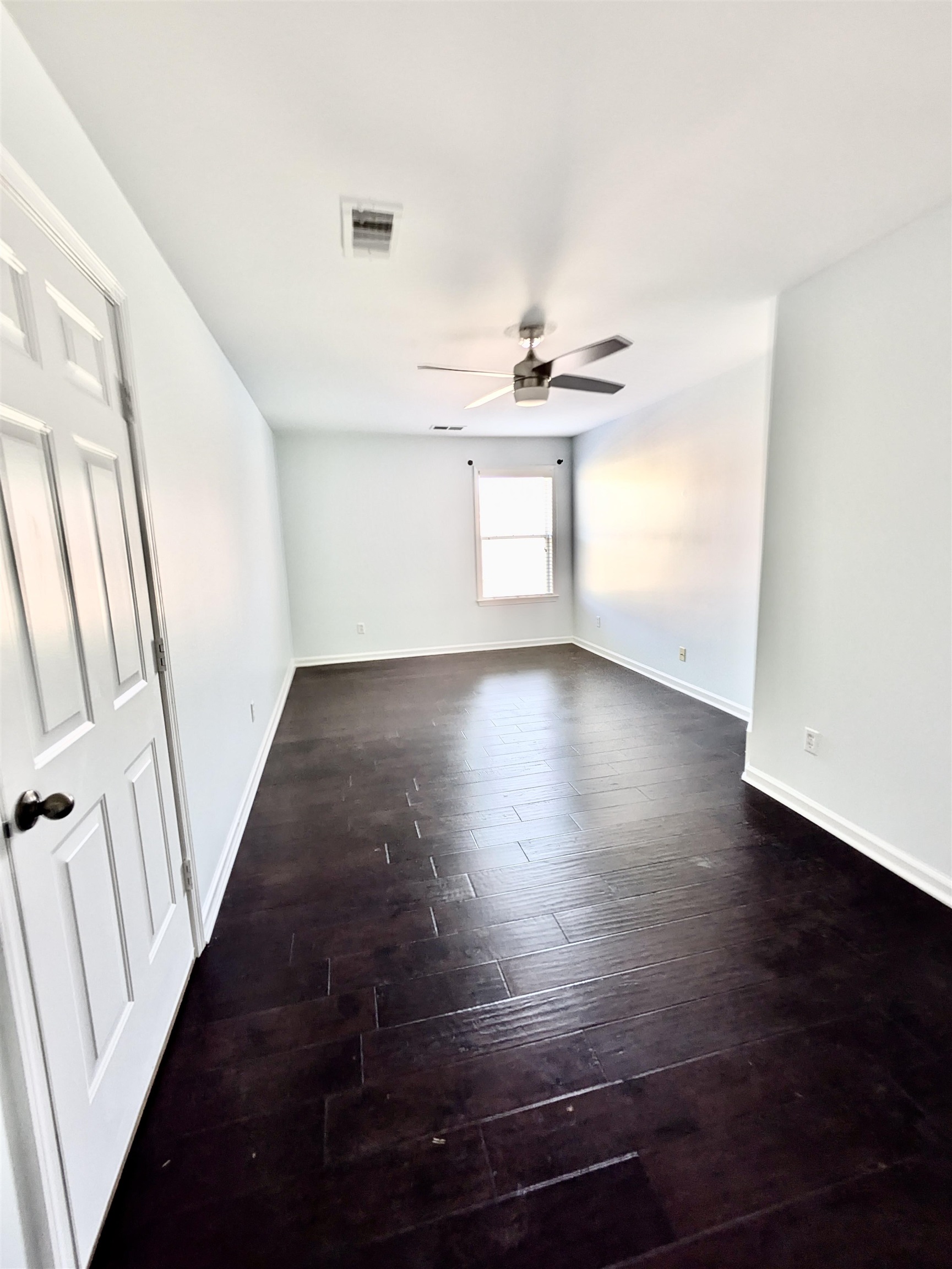 4560 Model Cove Bartlett, TN 38002 - Photo 13 of 18 a view of an empty room with wooden floor and a window