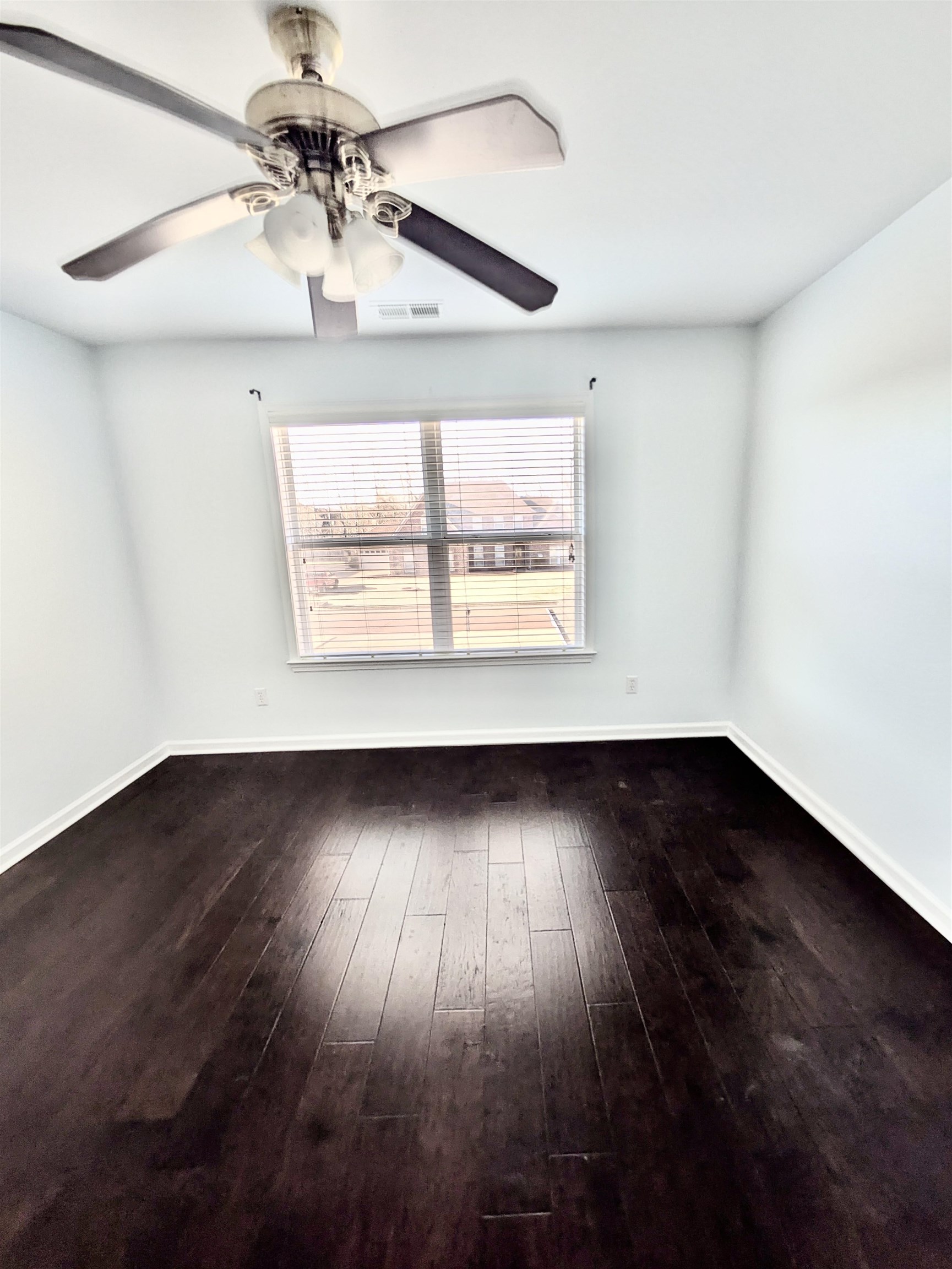 4560 Model Cove Bartlett, TN 38002 - Photo 15 of 18 a view of an empty room with wooden floor and a window