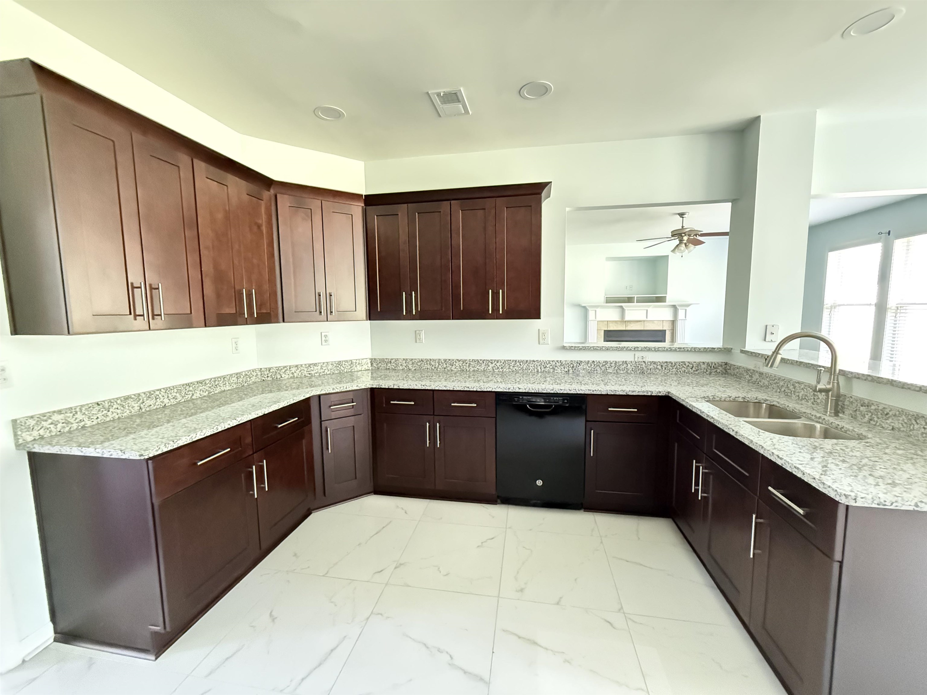 4560 Model Cove Bartlett, TN 38002 - Photo 4 of 18 a kitchen with granite countertop wooden cabinets and a granite counter top