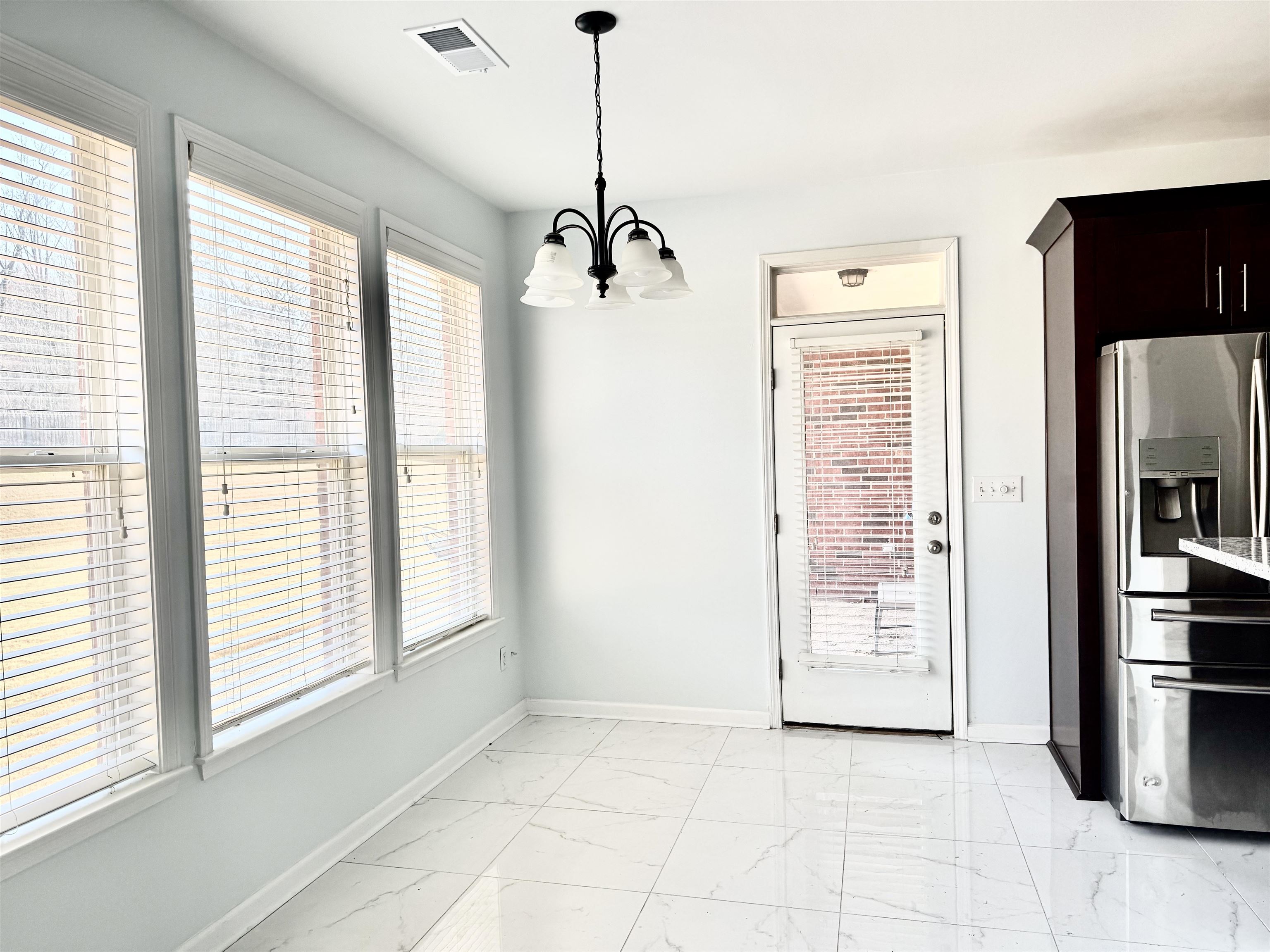 4560 Model Cove Bartlett, TN 38002 - Photo 6 of 18 a view of a kitchen with a sink and refrigerator