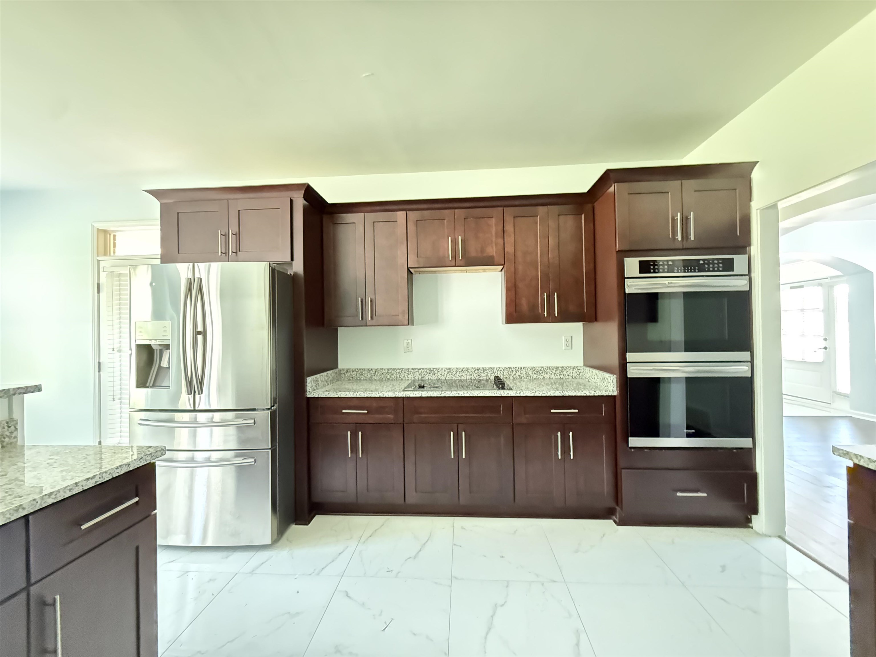 4560 Model Cove Bartlett, TN 38002 - Photo 7 of 18 a kitchen with granite countertop a refrigerator and a stove