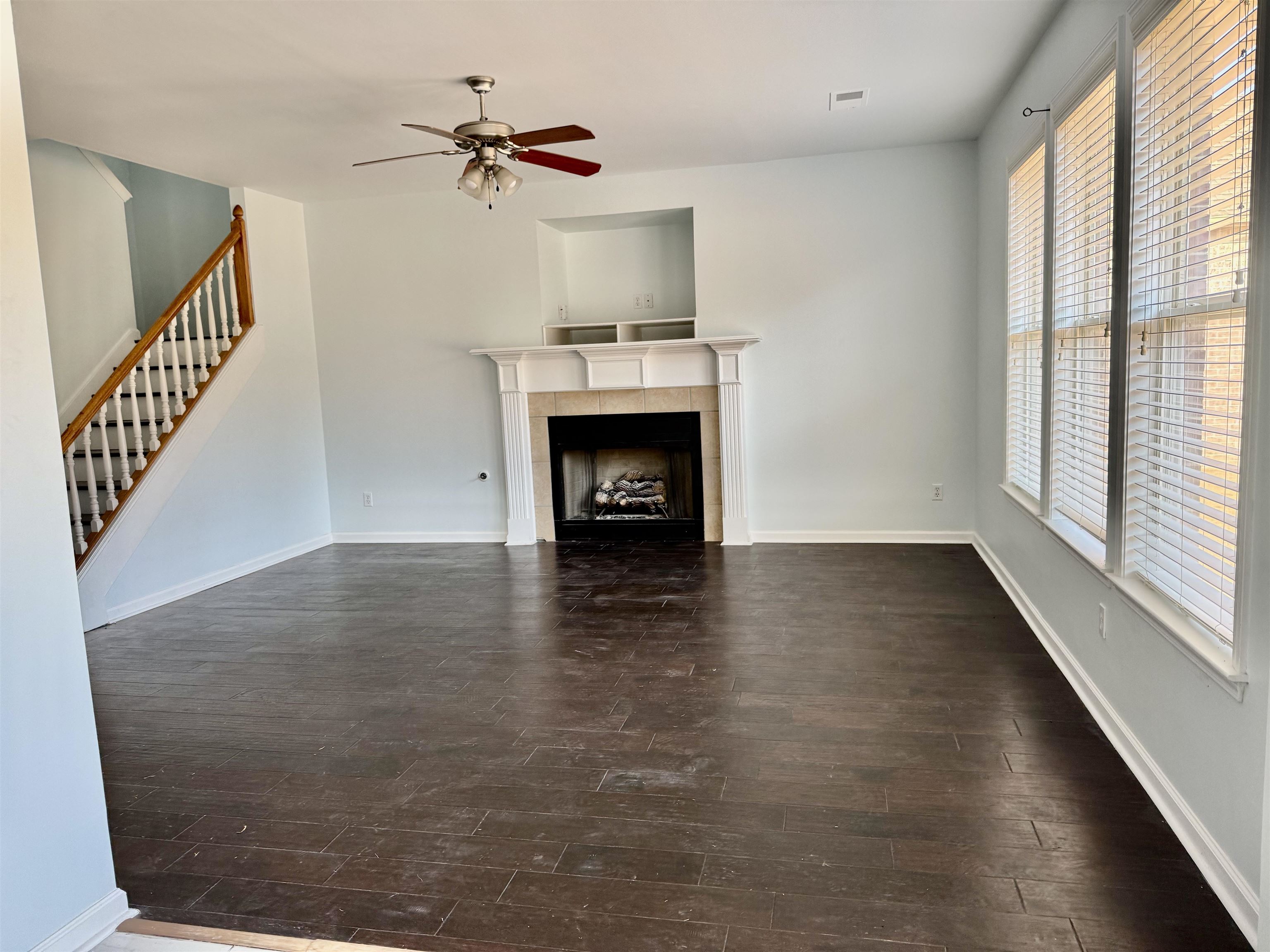 4560 Model Cove Bartlett, TN 38002 - Photo 8 of 18 a view of an empty room with a fireplace and a window