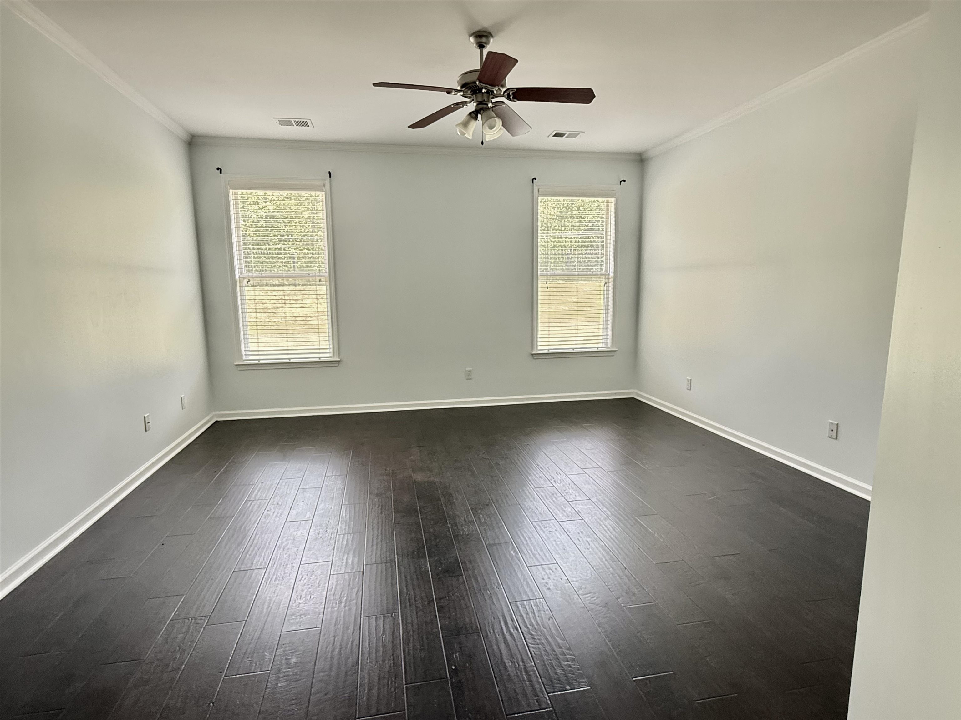 4560 Model Cove Bartlett, TN 38002 - Photo 10 of 18 an empty room with wooden floor and windows