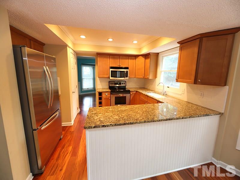 4328 Hickory Ridge Drive Raleigh, NC 27609 - Photo 3 of 16 Updated kitchen with stainless steel appliances and granite counter tops