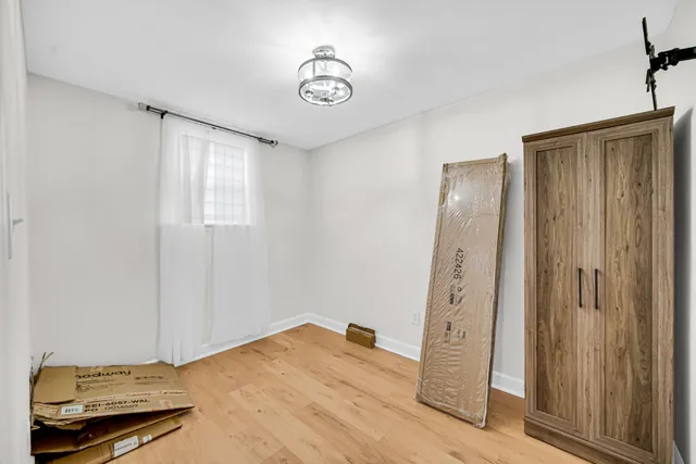 a view of a livingroom with wooden floor