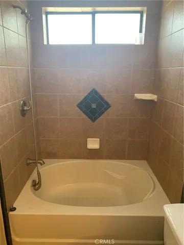 a bathroom with a bath tub