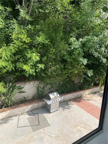 a view of a back yard of the house