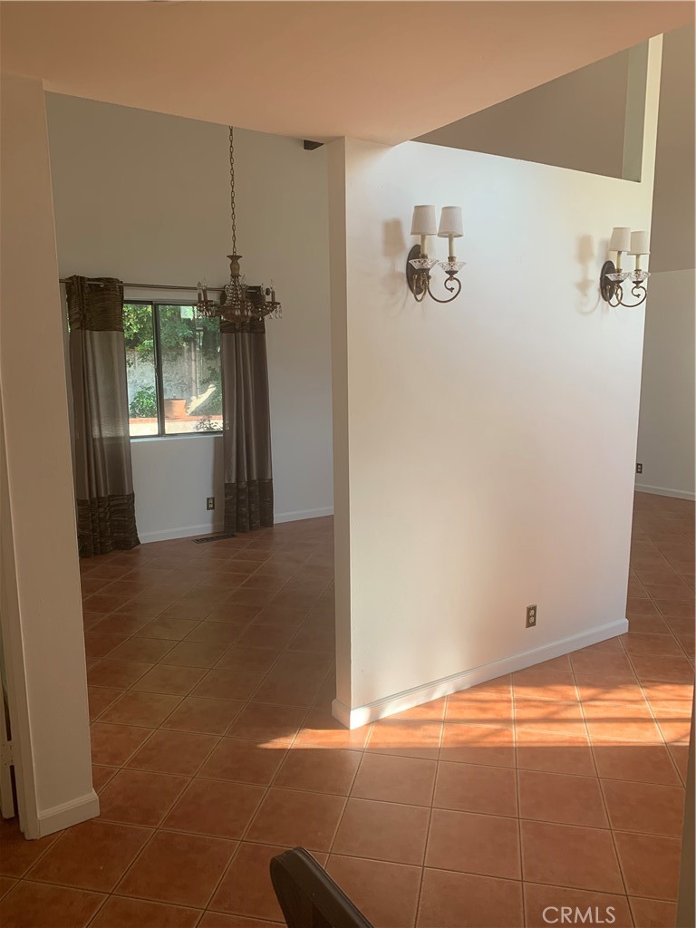 5246 Calderon Road Woodland Hills, CA 91364 - Photo 32 of 50 a view of a livingroom with furniture and floor to ceiling window