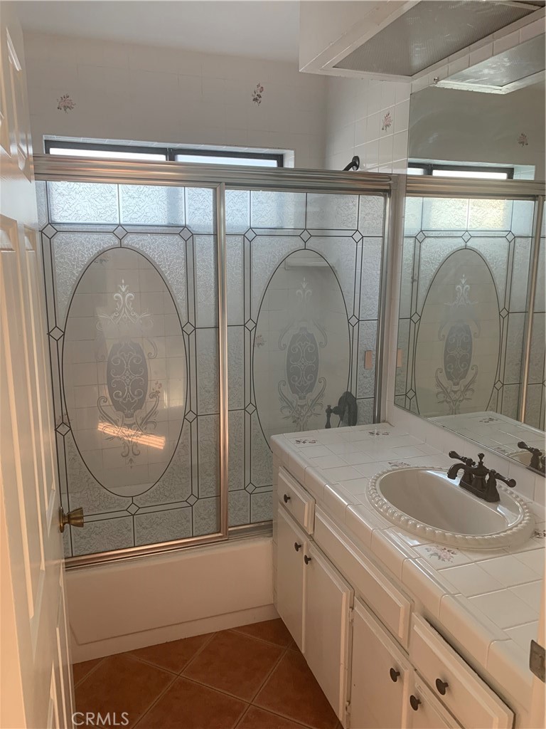 5246 Calderon Road Woodland Hills, CA 91364 - Photo 34 of 50 a bathroom with a sink mirror vanity and toilet