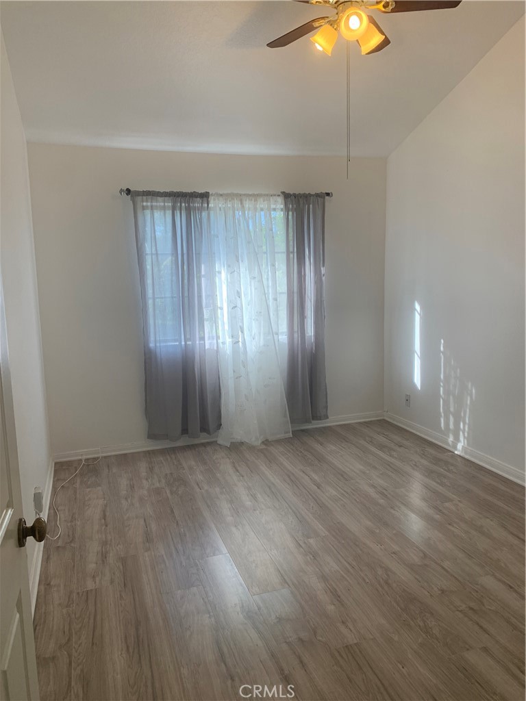 5246 Calderon Road Woodland Hills, CA 91364 - Photo 38 of 50 wooden floor in an empty room with a window