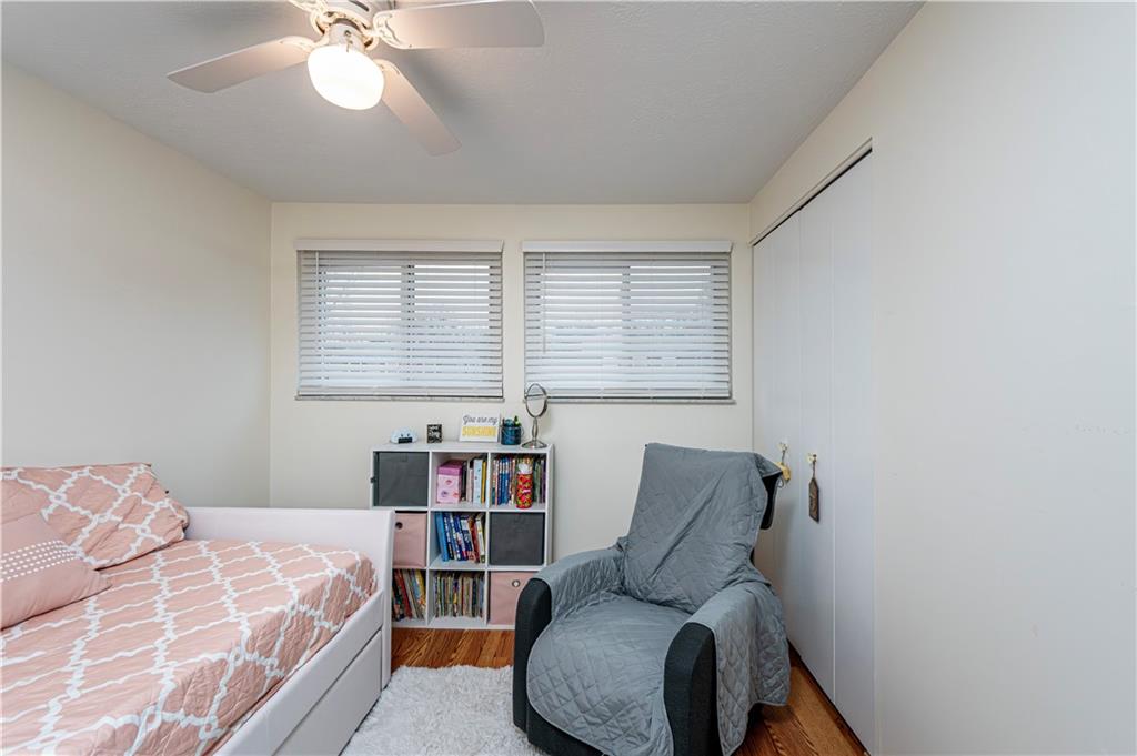 23 Seneca Drive Greensburg, PA 15601 - Photo 30 of 36 a bedroom with a bed and a chandelier