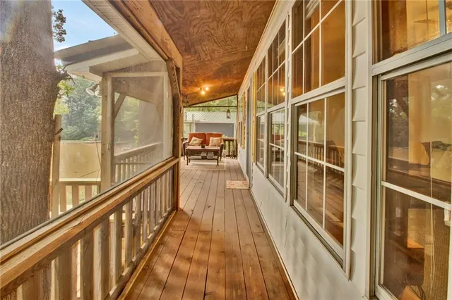 a view of balcony with wooden floor
