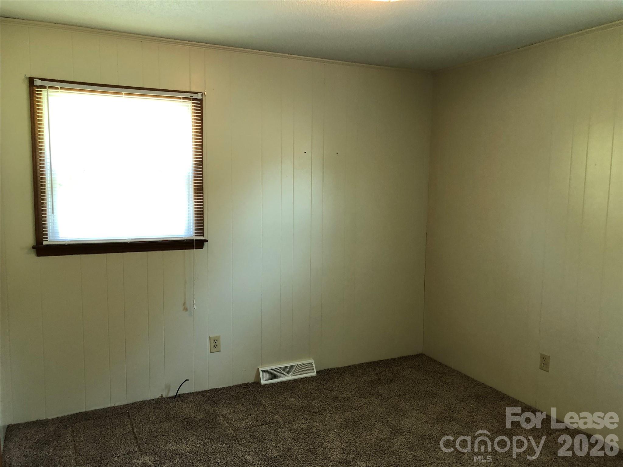 1411 Roundtree Lane, Unit 132 Lincolnton, NC 28092 - Photo 5 of 7 an empty room with a window