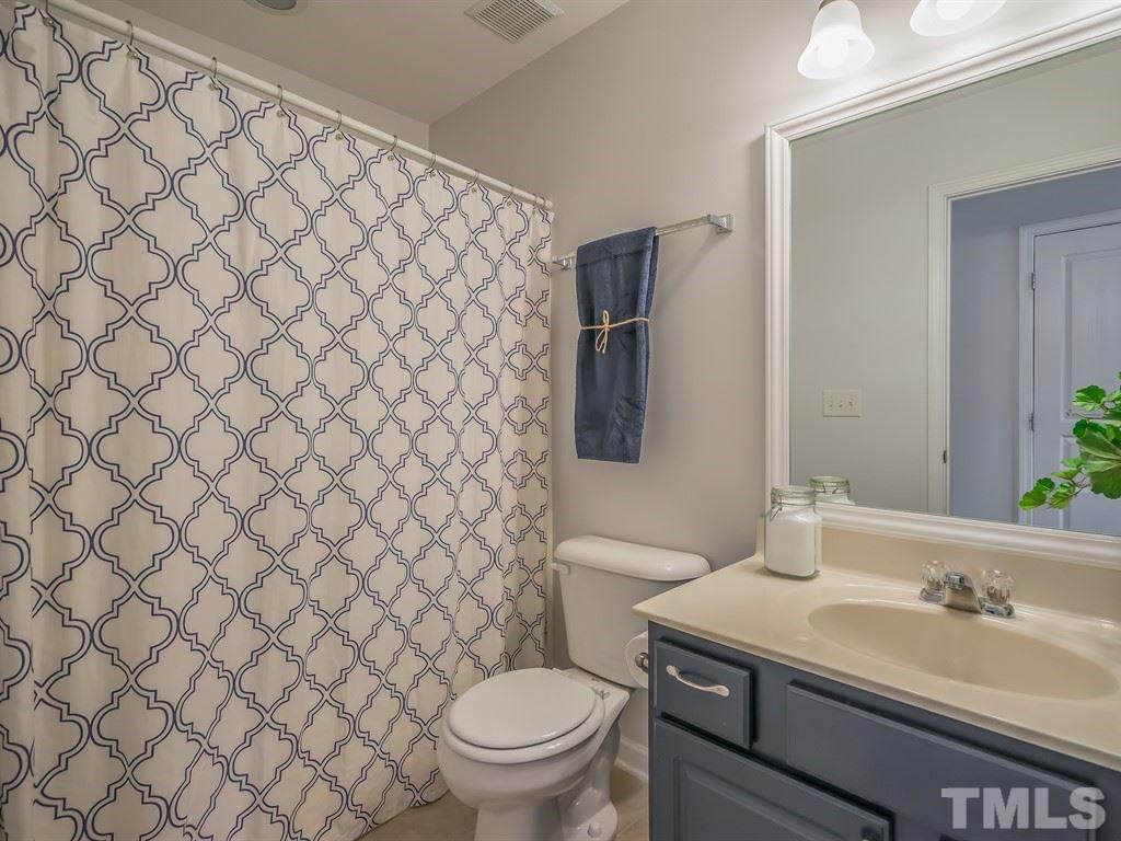 7865 Spungold Street Raleigh, NC 27617 - Photo 11 of 15 a bathroom with a sink and a toilet