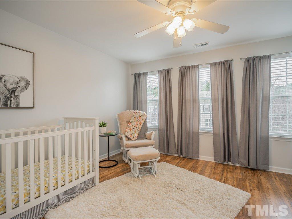 7865 Spungold Street Raleigh, NC 27617 - Photo 12 of 15 a living room with furniture and a window