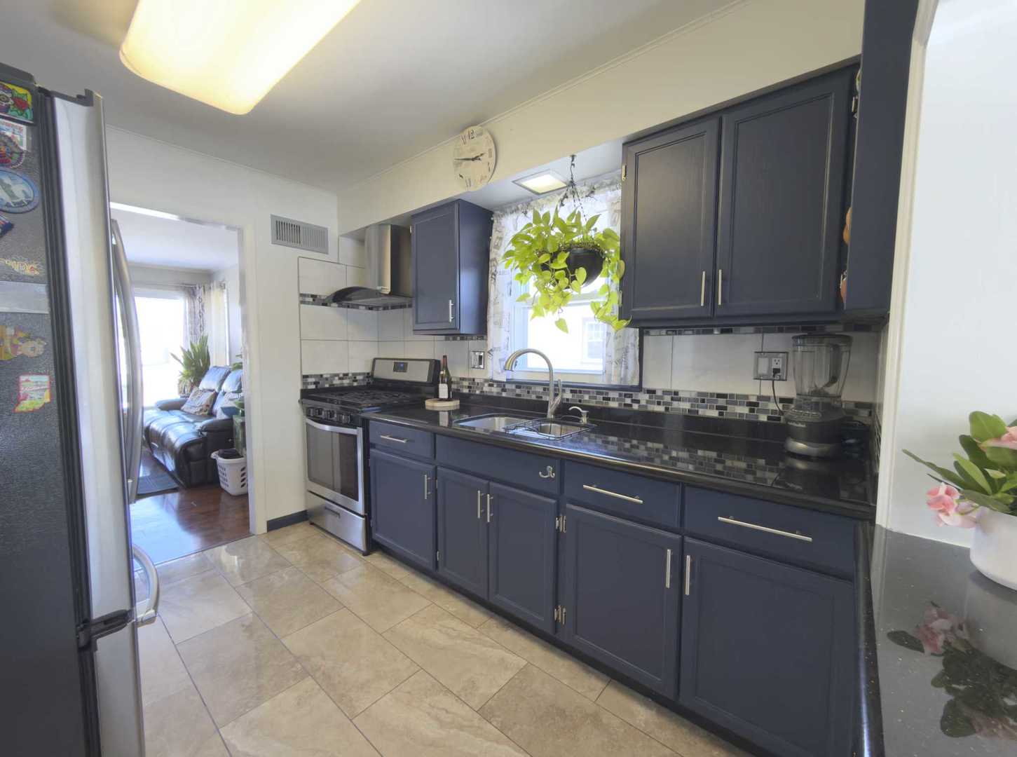 2035 Fargo Street Des Plaines, IL 60018 - Photo 12 of 19 a kitchen with a sink stove and cabinets