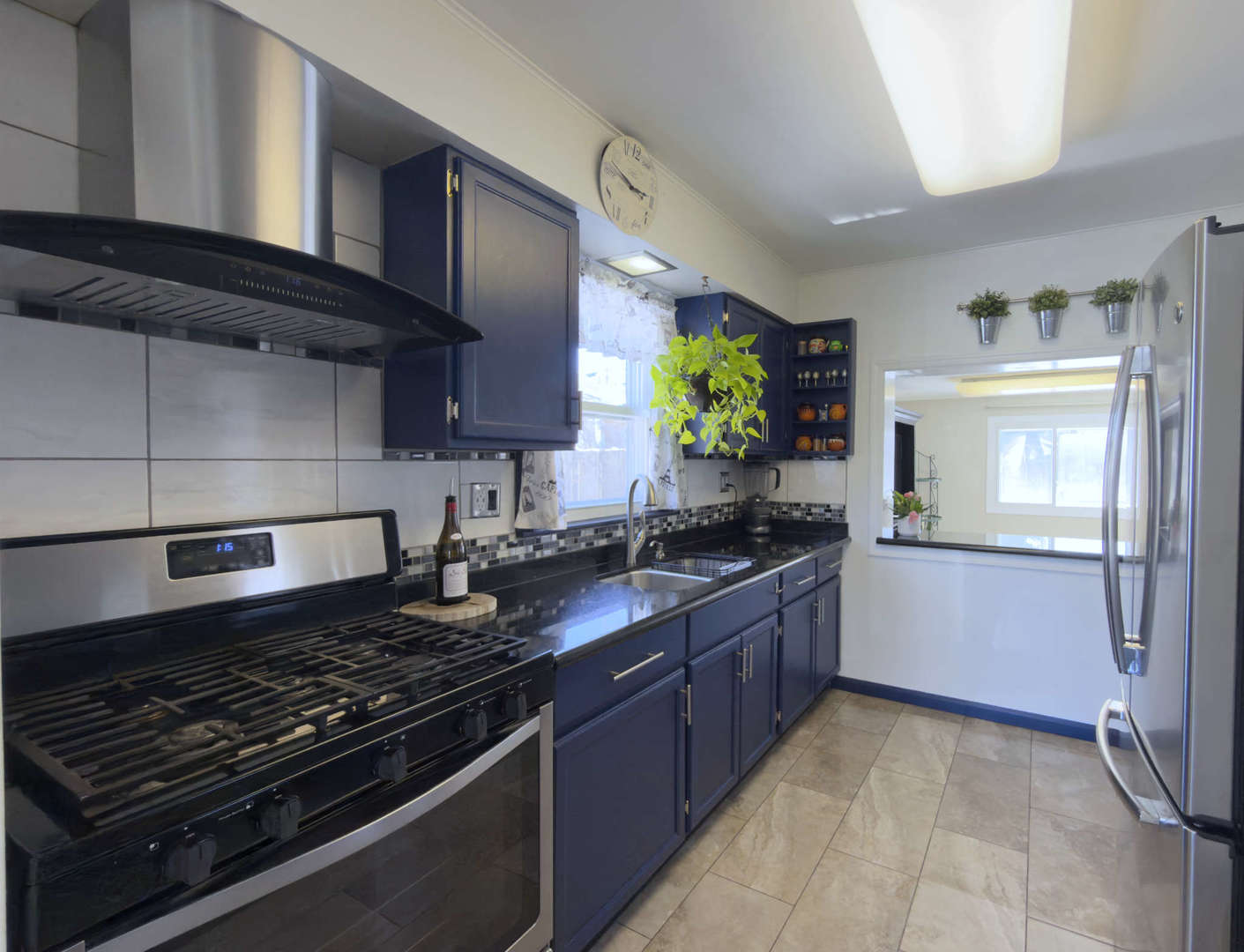 2035 Fargo Street Des Plaines, IL 60018 - Photo 14 of 19 a kitchen with stainless steel appliances granite countertop a stove and a sink