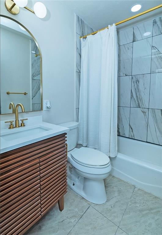 3807 Greenhill Drive Chamblee, GA 30341 - Photo 14 of 23 a bathroom with a sink a toilet and shower