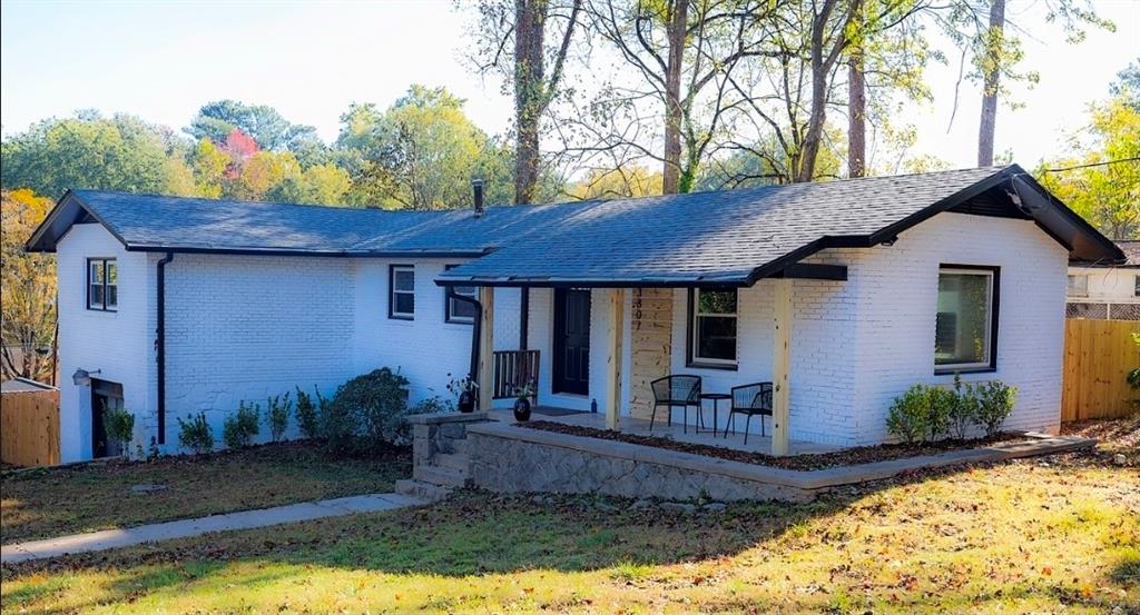 3807 Greenhill Drive Chamblee, GA 30341 - Photo 21 of 23 a front view of a house with garden