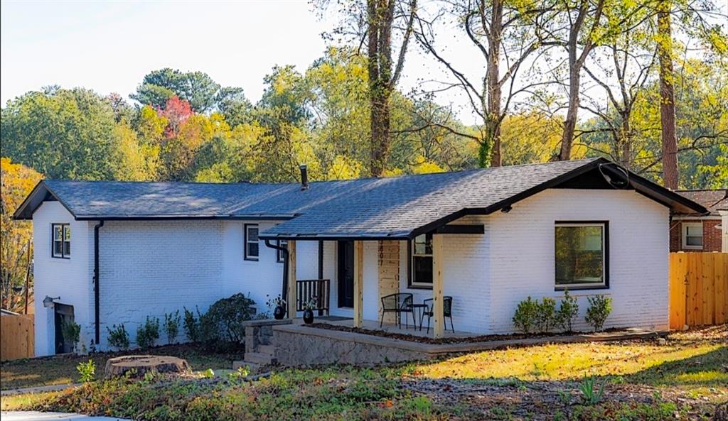 3807 Greenhill Drive Chamblee, GA 30341 - Photo 23 of 23 a view of a house with pool and chairs