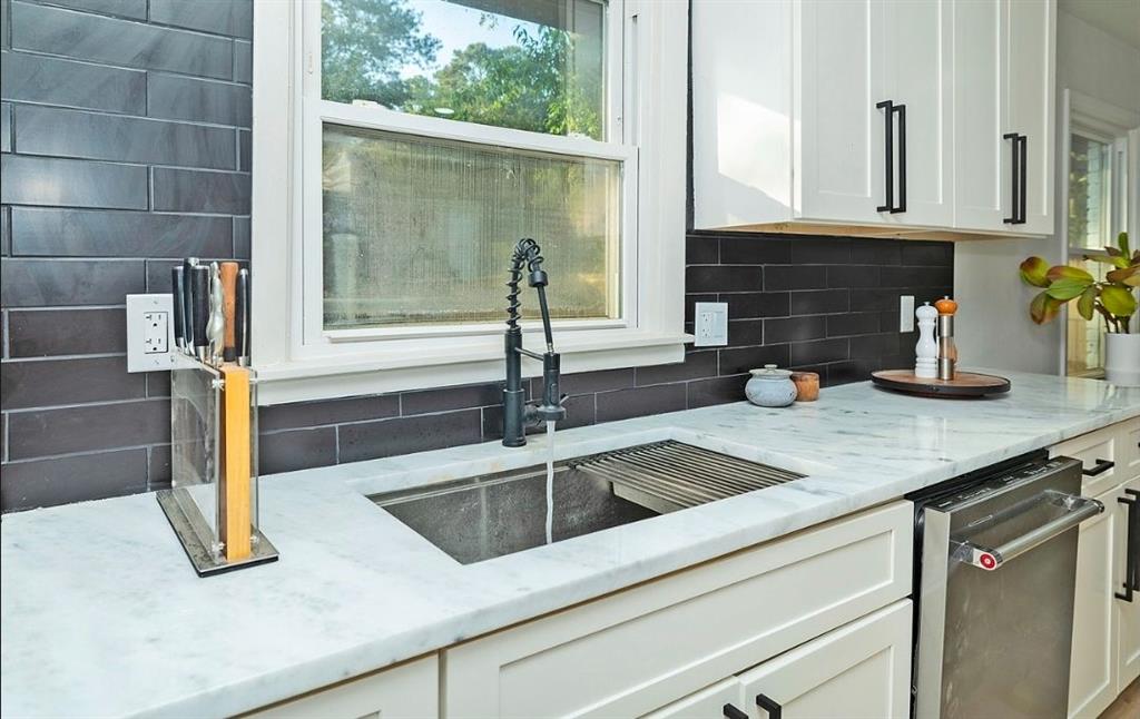 3807 Greenhill Drive Chamblee, GA 30341 - Photo 10 of 23 a kitchen with granite countertop a sink and a window