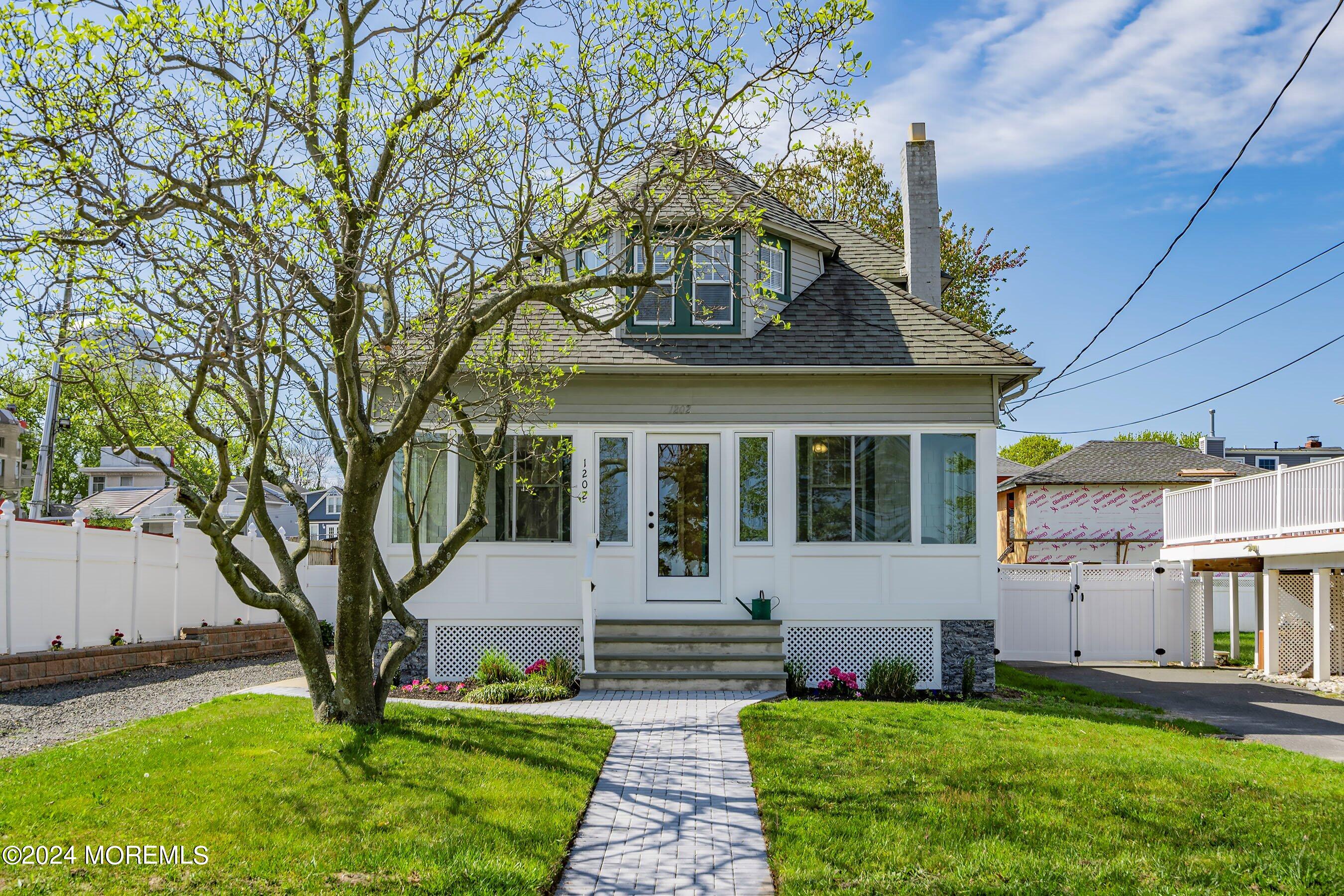 1202 River Road Belmar, NJ 07719 - Photo 1 of 32 a front view of a house with garden