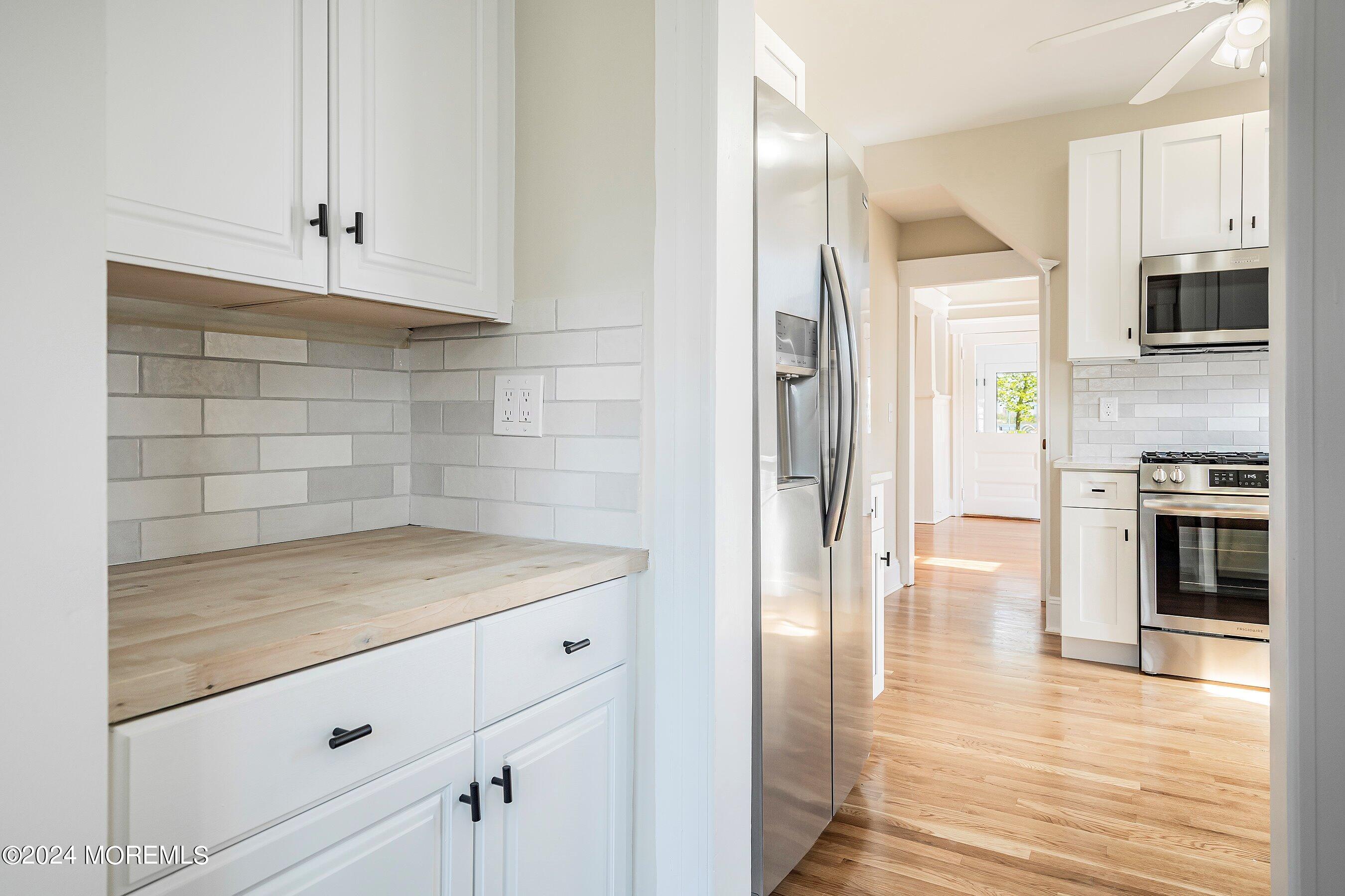 1202 River Road Belmar, NJ 07719 - Photo 16 of 32 a view of a kitchen cabinets and stainless steel appliances