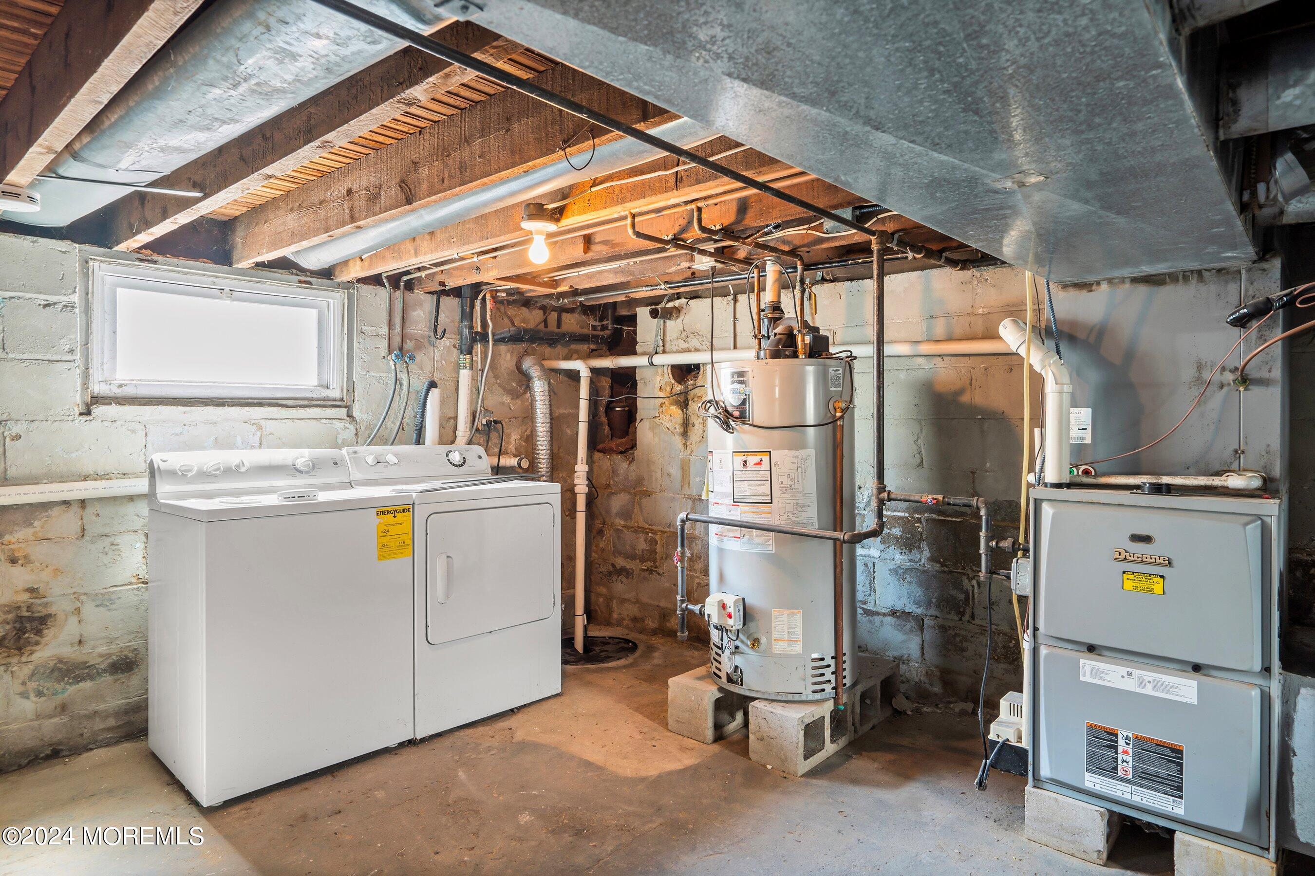 1202 River Road Belmar, NJ 07719 - Photo 26 of 32 a utility room with dryer and washer