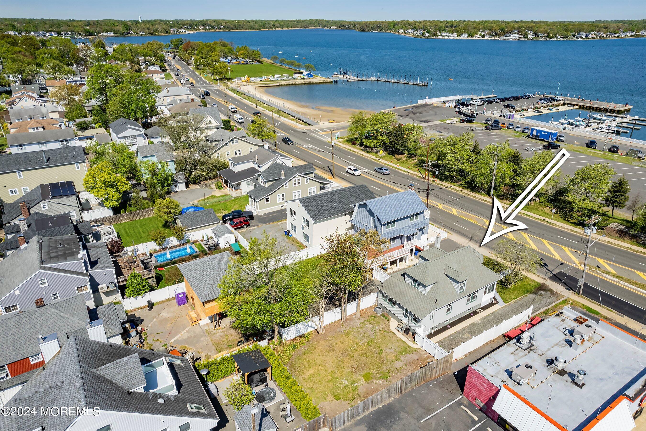 1202 River Road Belmar, NJ 07719 - Photo 32 of 32 an aerial view of a house with a swimming pool