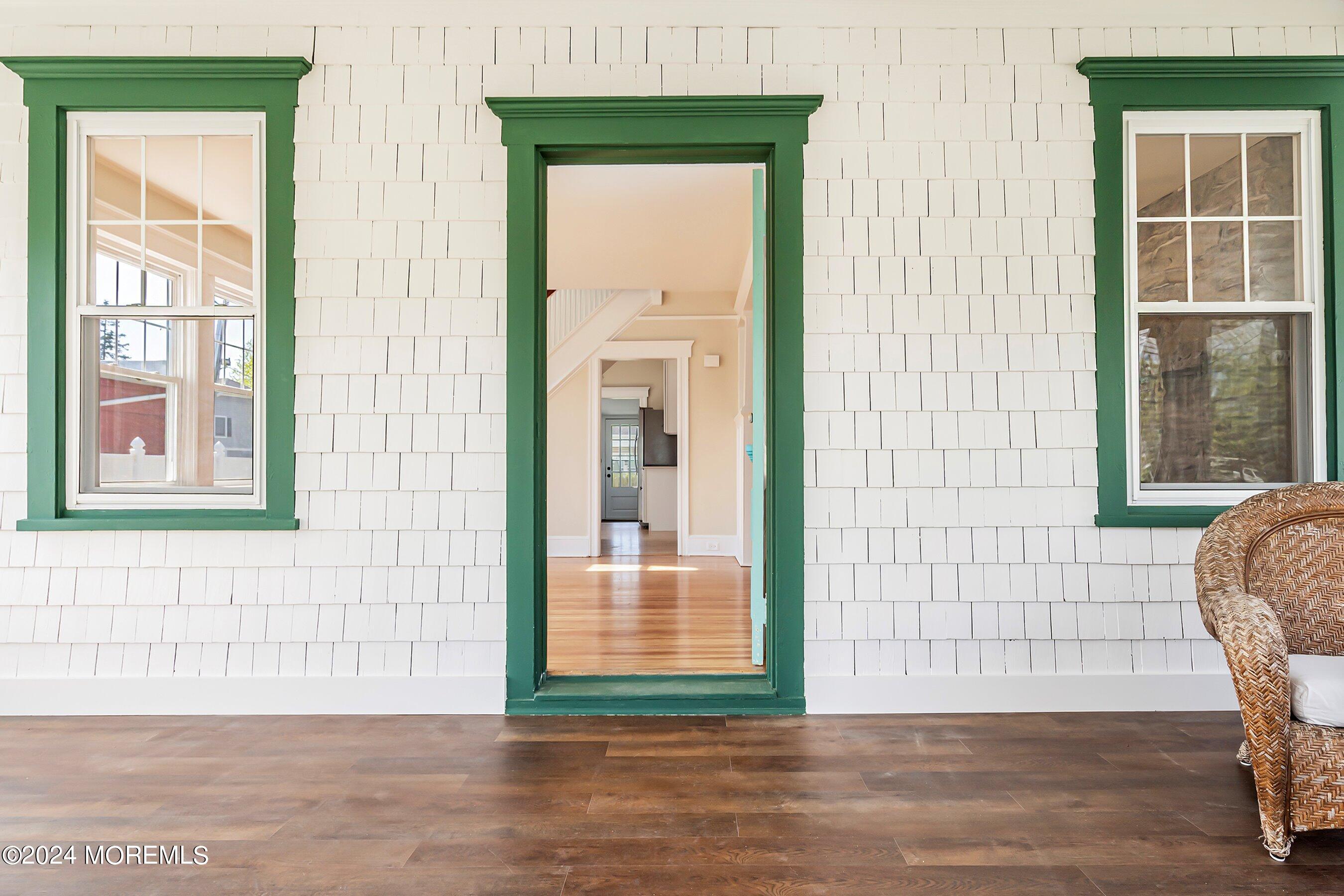 1202 River Road Belmar, NJ 07719 - Photo 6 of 32 a view of a door with a chair and a door