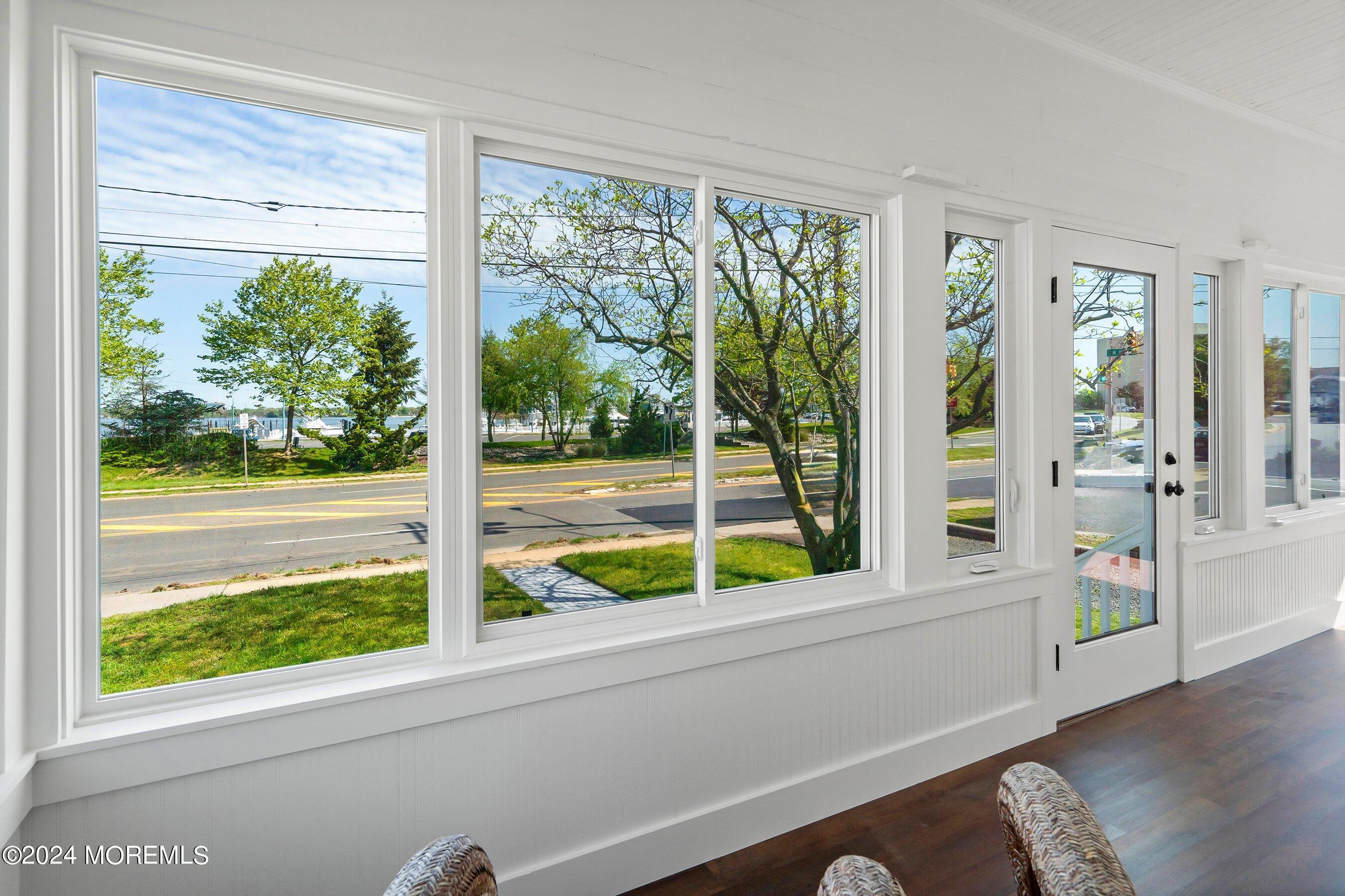 1202 River Road Belmar, NJ 07719 - Photo 8 of 32 a view of a porch with furniture and front door