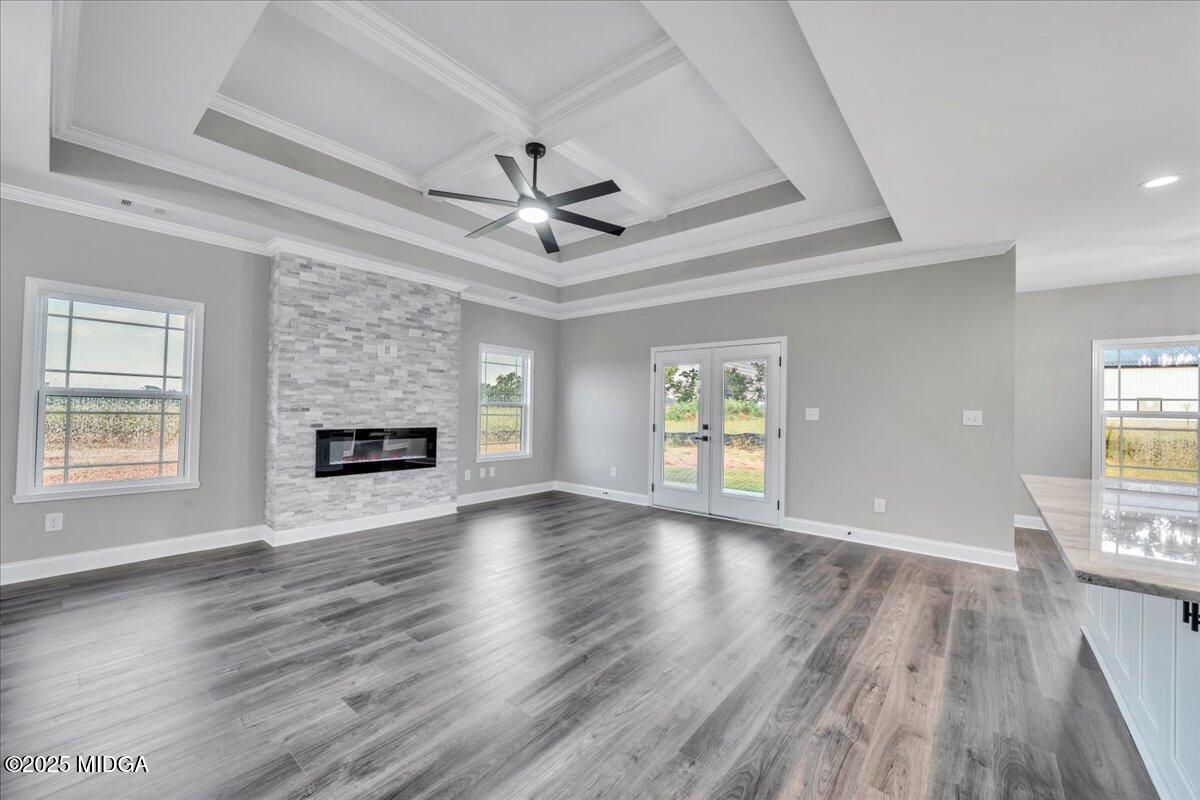 200 Eric Court Byron, GA 31008 - Photo 15 of 58 a view of an empty room with wooden floor and a window
