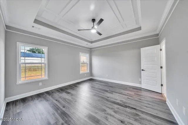 a bathroom with a granite countertop sink mirror and bathtub