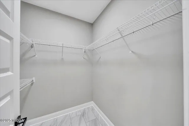 a bathroom with a granite countertop sink double and mirror