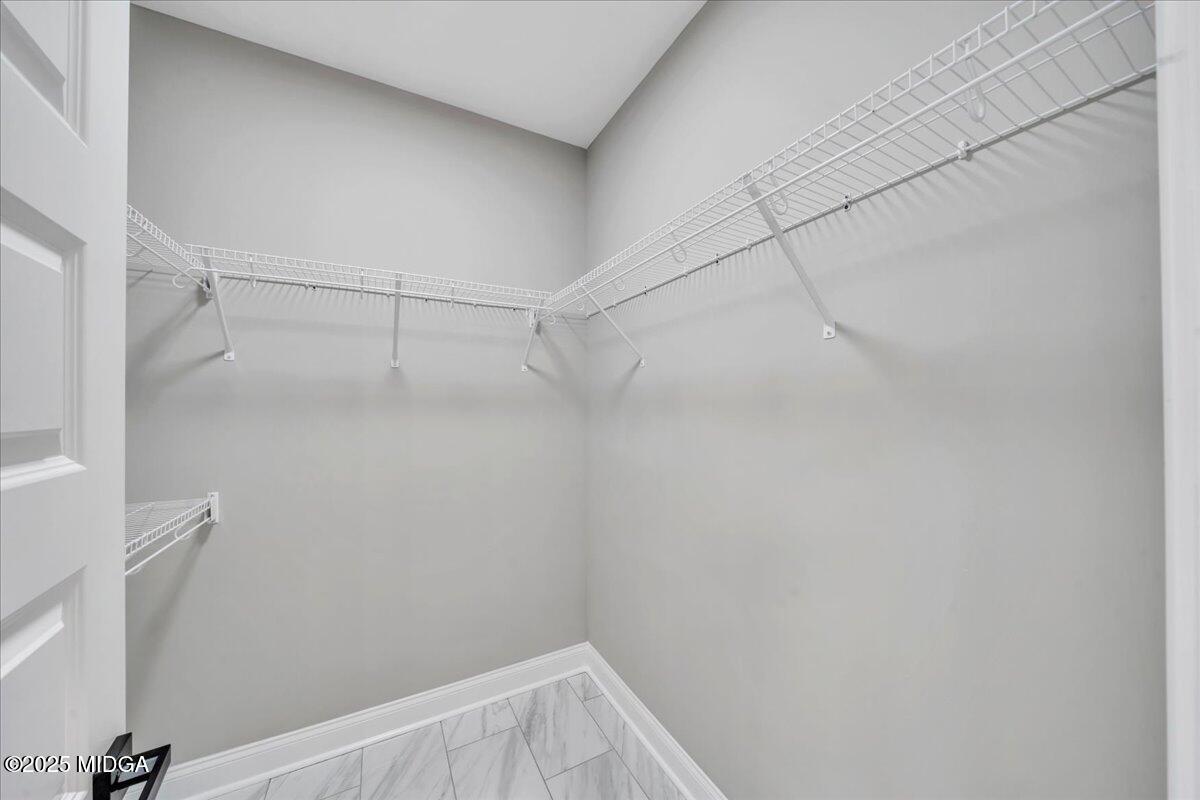 200 Eric Court Byron, GA 31008 - Photo 34 of 58 a view of a room with racks on the wall