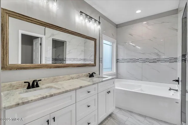 a bathroom with a double vanity sink mirror and double