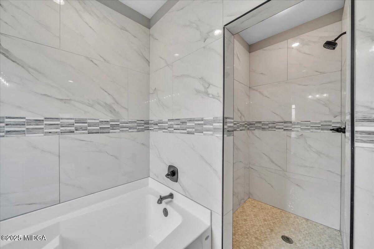 200 Eric Court Byron, GA 31008 - Photo 37 of 58 a bathroom with a bathtub and a shower