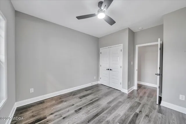 a view of an empty room with a balcony