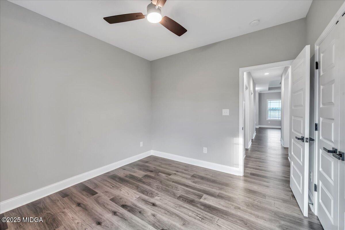 200 Eric Court Byron, GA 31008 - Photo 44 of 58 a view of an empty room with wooden floor