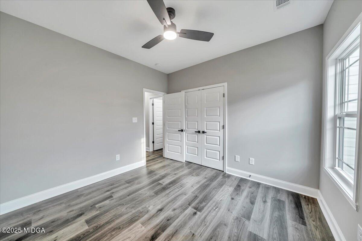 200 Eric Court Byron, GA 31008 - Photo 45 of 58 wooden floor in an empty room with a window