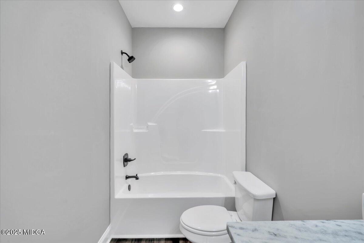 200 Eric Court Byron, GA 31008 - Photo 47 of 58 a bathroom with a toilet and bathtub