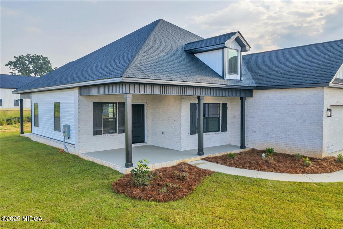 200 Eric Court Byron, GA 31008 - Photo 6 of 58 a front view of a house with a yard