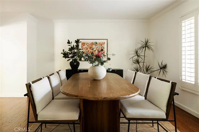 a view of a dining room with furniture and window