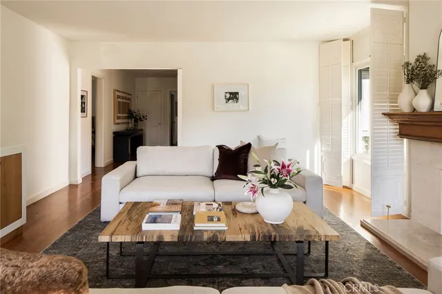 a living room with furniture and flowers