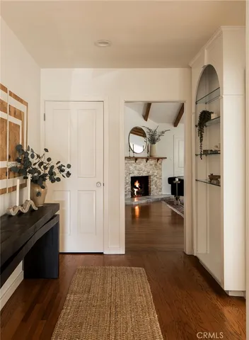 a view of living room with furniture and wooden floor