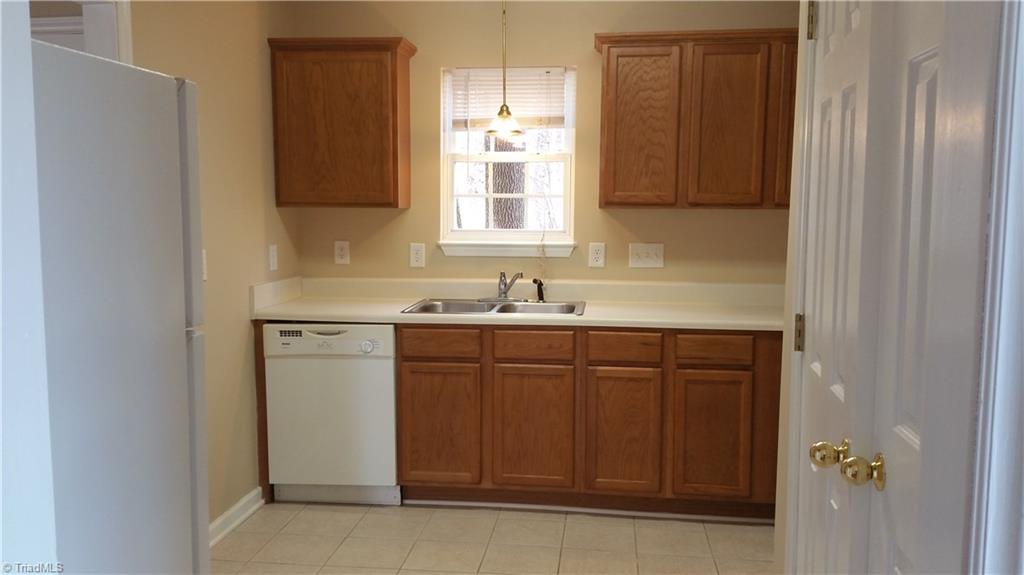 1727 Foust Road Greensboro, NC 27405 - Photo 8 of 19 Another view of kitchen showing sink space! Home has new paint throughout!