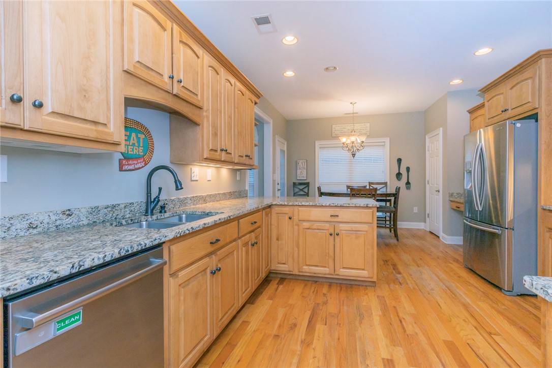 105 Sycamore Drive Clemson, SC 29631 - Photo 14 of 35 This spacious kitchen offers ample countertop space and a cozy dining area.