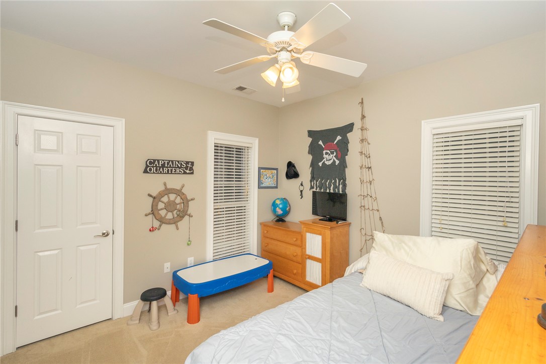 105 Sycamore Drive Clemson, SC 29631 - Photo 16 of 35 This cozy bedroom features carpeted floors and a ceiling fan, perfect for comfortable living.