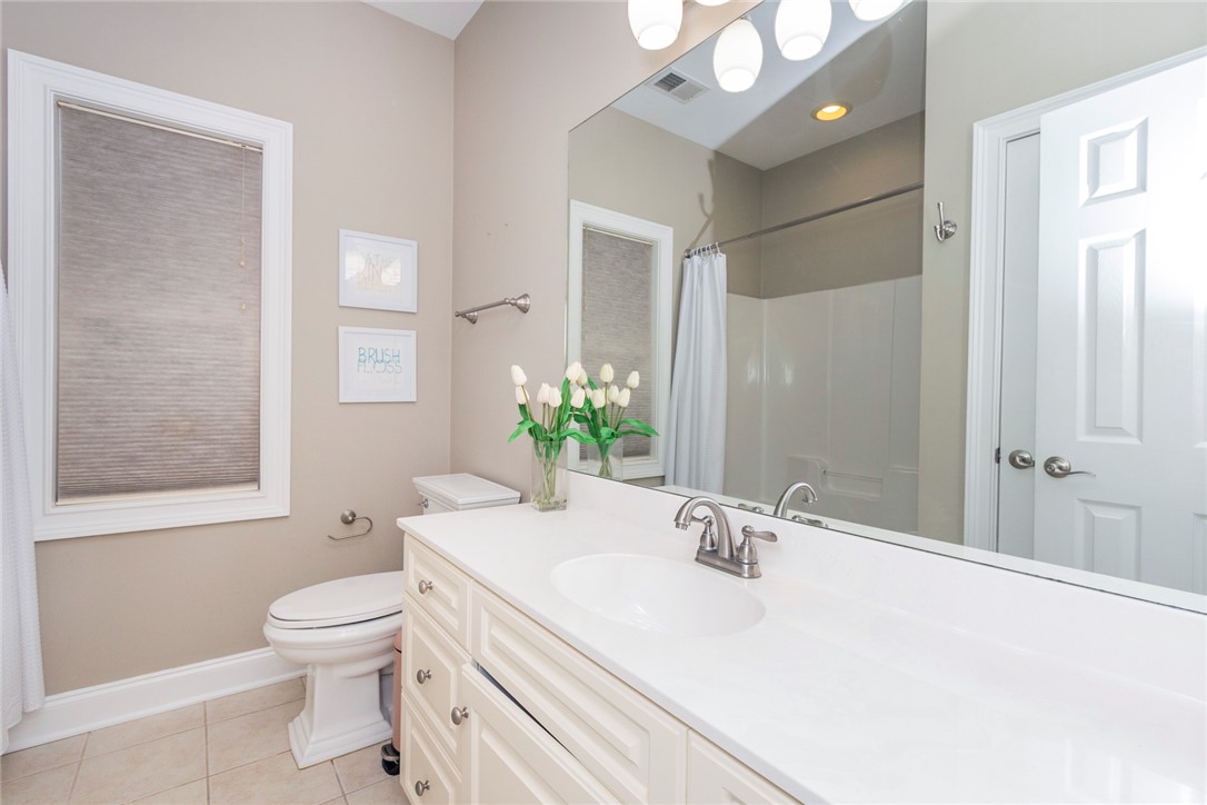 105 Sycamore Drive Clemson, SC 29631 - Photo 18 of 35 This bright bathroom features a spacious vanity, toilet, and a window for natural light.